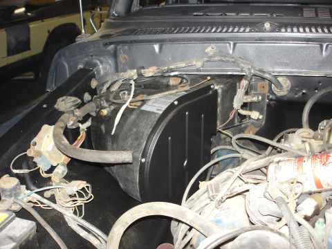 1979 Ford F-250 - Engine bay of a 1979 Ford F-250, showing the heater box and various engine components.