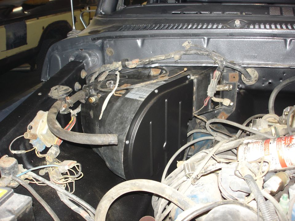 1979 Ford F-250 engine bay with heater box and wiring