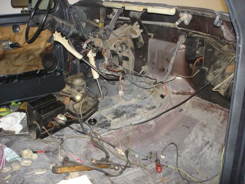 1979 Ford F-250 - The interior of a 1979 Ford F-250 shows extensive exposed wiring and a disassembled dashboard, indicating ongoing repairs or modifications.