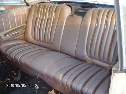 1963 Ford Galaxie - Interior view of a 1963 Ford Galaxie, showing the tan pleated seats and door panel.