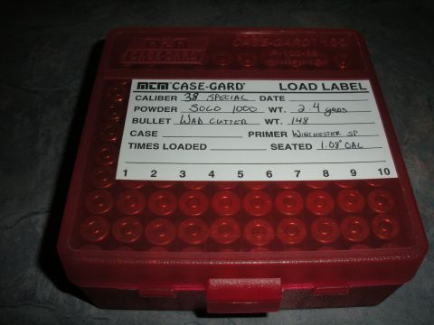 1996 Ford Bronco - A red ammunition case with a handwritten label showing load data for 38 Special cartridges.