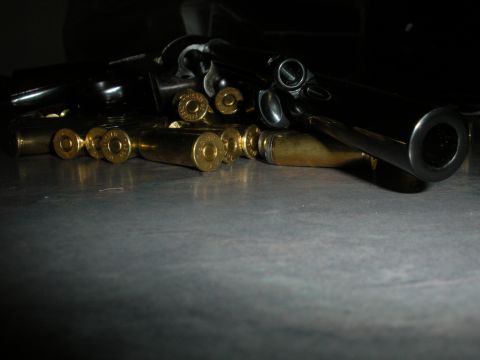 1996 Ford Bronco - A close-up view of a firearm and its spent ammunition casings.
