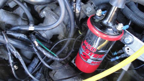 1995 Ford Probe - This image shows an aftermarket MSD ignition coil installed in a vehicle's engine compartment.