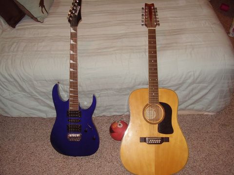 1996 Ford F-150 - Two guitars, an electric and a 12-string acoustic, are displayed on the floor.