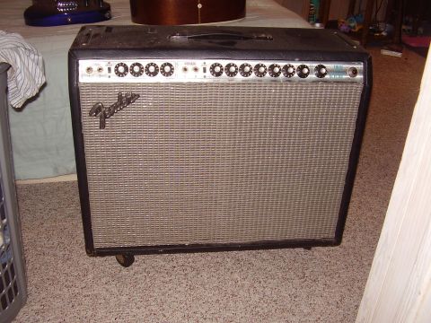 1996 Ford F-150 - A Fender Twin Reverb amplifier sits on a carpeted floor, with musical instruments in the background.