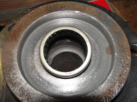 1995 Ford Bronco - Close-up view of a wheel bearing with 'USA' visible, installed in a rusty metal component.