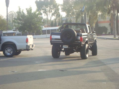 1986 Ford Bronco - This lifted 1986 Ford Bronco is seen from the rear, with a spare tire mounted on the tailgate.