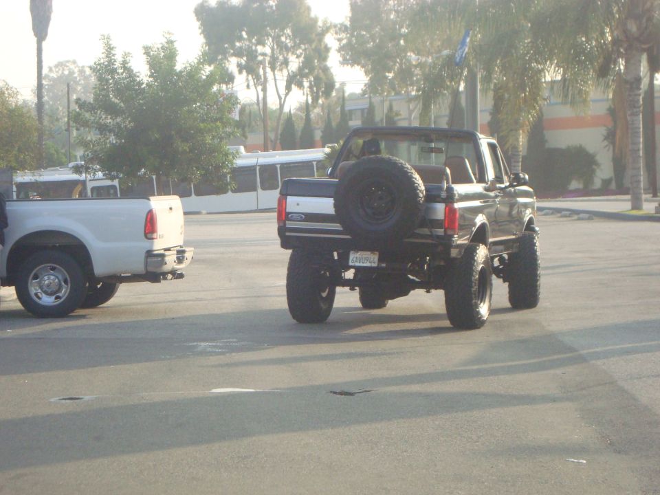 Black 1986 Ford Bronco rear view with spare tire