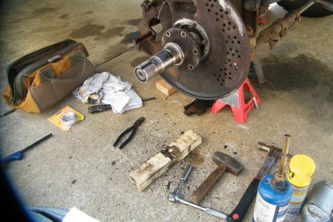 1989 Ford Bronco - The nuts came off fine but the spindle did not. I ended up using a block of wood and my heavy hammer. Started beating it up and down, left…