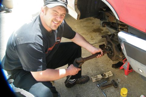 1989 Ford Bronco - Spindle and dust cover gone. Pulling axle through the knuckle. That U Joint was shot. Got one for for $30. The old one looked old, rusted a…