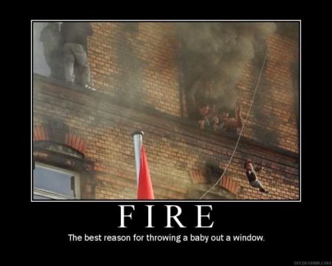 1989 Ford Bronco - A building is on fire, and people are seen escaping from the windows.