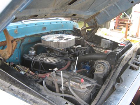1972 Ford F-250 - Engine bay of a 1972 Ford F-250, showing the V8 engine with custom parts.