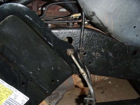 1995 Ford Bronco - Close-up view of brake lines and chassis components.