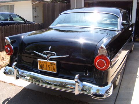 1956 Ford Fairlane - Rear view of a black 1956 Ford Fairlane with a California license plate.