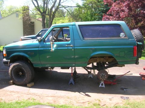 1996 Ford Bronco - 1996 Ford Bronco undergoing maintenance with its rear axle disassembled.