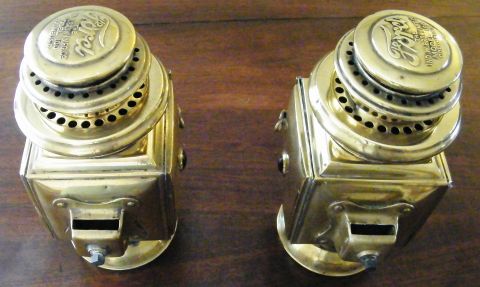 1912 Ford Model T - Pair of 1912 Ford Model T carbide lamps, showing embossed Ford logos on the caps.