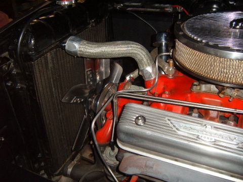 1956 Ford Fairlane - Close-up of a 1956 Ford Fairlane engine bay, showing the 'Thunderbird' branding on the valve cover.