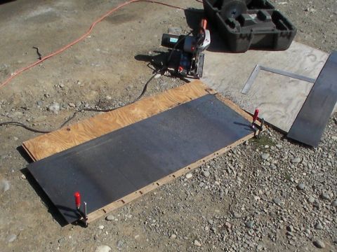 1987 Suzuki Samurai - Cutting a metal sheet with a chop saw on a plywood base.