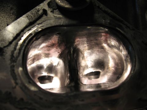1991 Mitsubishi 3000GT - Close-up view of an engine's cylinder head, revealing the condition of its intake ports.