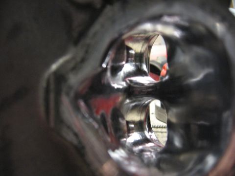 1991 Mitsubishi 3000GT - Close-up view of polished intake manifold ports, showing internal reflections and red accents.
