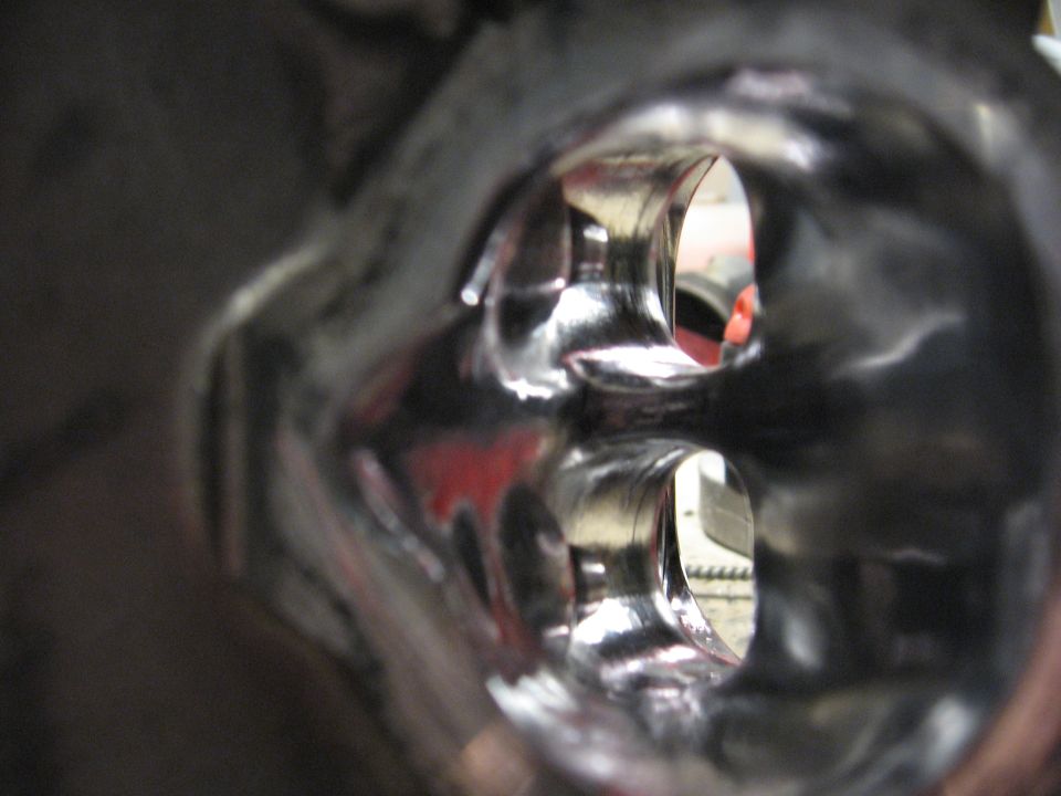Polished intake manifold ports with red accents visible inside