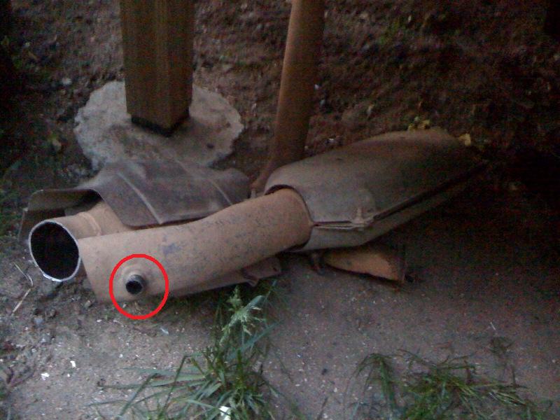 exhaust pipe with a sensor circled in red