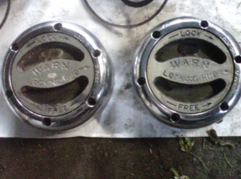 1995 Ford Bronco - Pair of Warn locking hubs, likely for an off-road vehicle's front axle.
