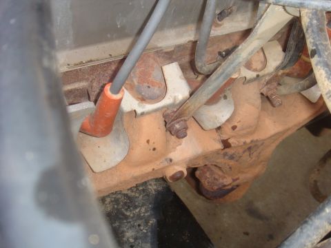 1992 Ford Bronco - Engine components visible in the photo, showing spark plug wires and rusty metal.