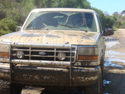 1992 Ford Bronco - This mud-covered 1992 Ford Bronco shows significant damage to its windshield after an off-road excursion.