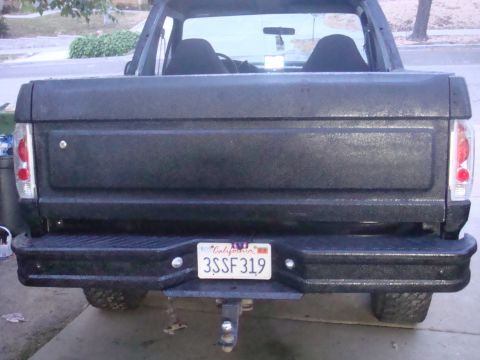 1992 Ford Bronco - The rear of a black 1992 Ford Bronco is shown, a California license plate.