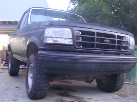 1992 Ford Bronco - This 1992 Ford Bronco is viewed from the front, highlighting its distinctive grille and headlights.