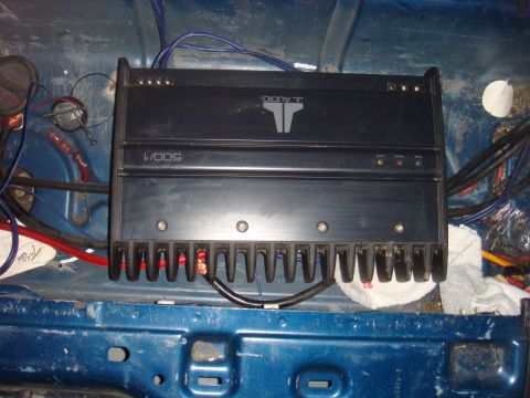 1992 Ford Bronco - A JL Audio 500/1 amplifier is visible, mounted inside a vehicle's blue interior.