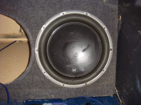 1992 Ford Bronco - A close-up view of a car subwoofer installed in a custom enclosure.