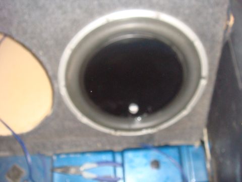 1992 Ford Bronco - Car speaker installation detail, showing the speaker cone and mounting enclosure.