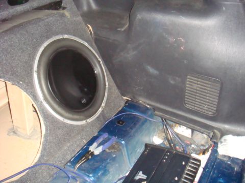 1992 Ford Bronco - Custom car audio setup in the trunk, showing a subwoofer and amplifier.