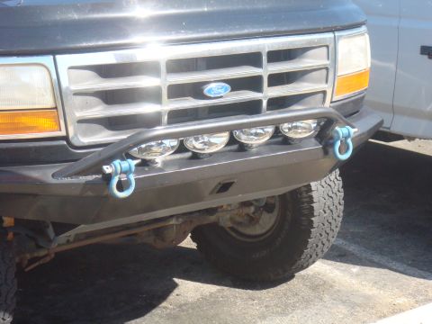1992 Ford Bronco - Front view of a 1992 Ford Bronco, an aftermarket bumper with fog lights.