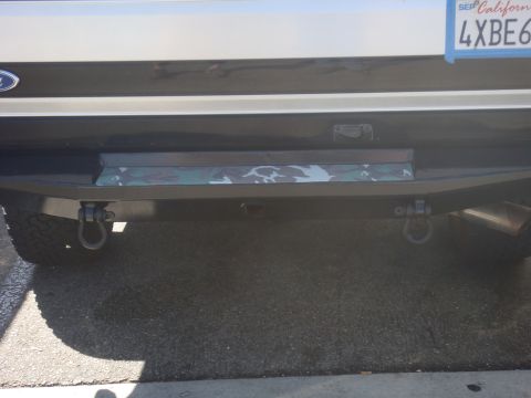 1992 Ford Bronco - The rear of a 1992 Ford Bronco shows a custom bumper with tow hooks and a California license plate.
