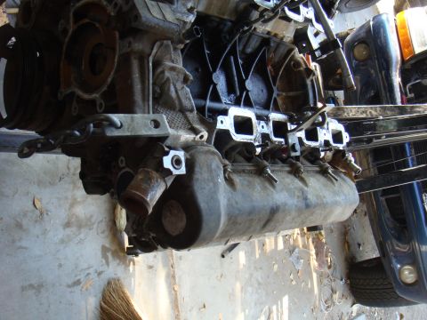 1992 Ford Bronco - Close-up view of a vehicle engine, likely out of a car or truck.