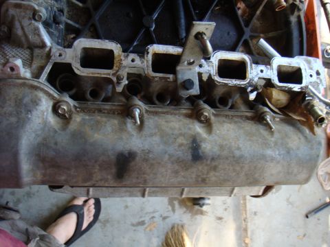 1992 Ford Bronco - Close-up view of an engine's intake manifold, showing its internal structure and mounting points.