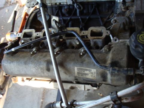 1992 Ford Bronco - Close-up view of an engine block, showing various components and some identifying text.