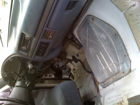 1992 Ford Bronco - Interior view of a 1992 Ford Bronco, revealing the dashboard and wiring beneath.