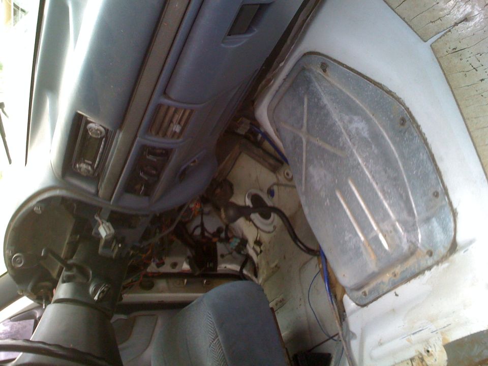 1992 Ford Bronco interior showing dashboard, steering column, and exposed wiring