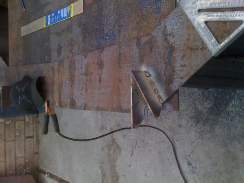 1992 Ford Bronco - Metal fabrication in progress with welding equipment and tools laid out.