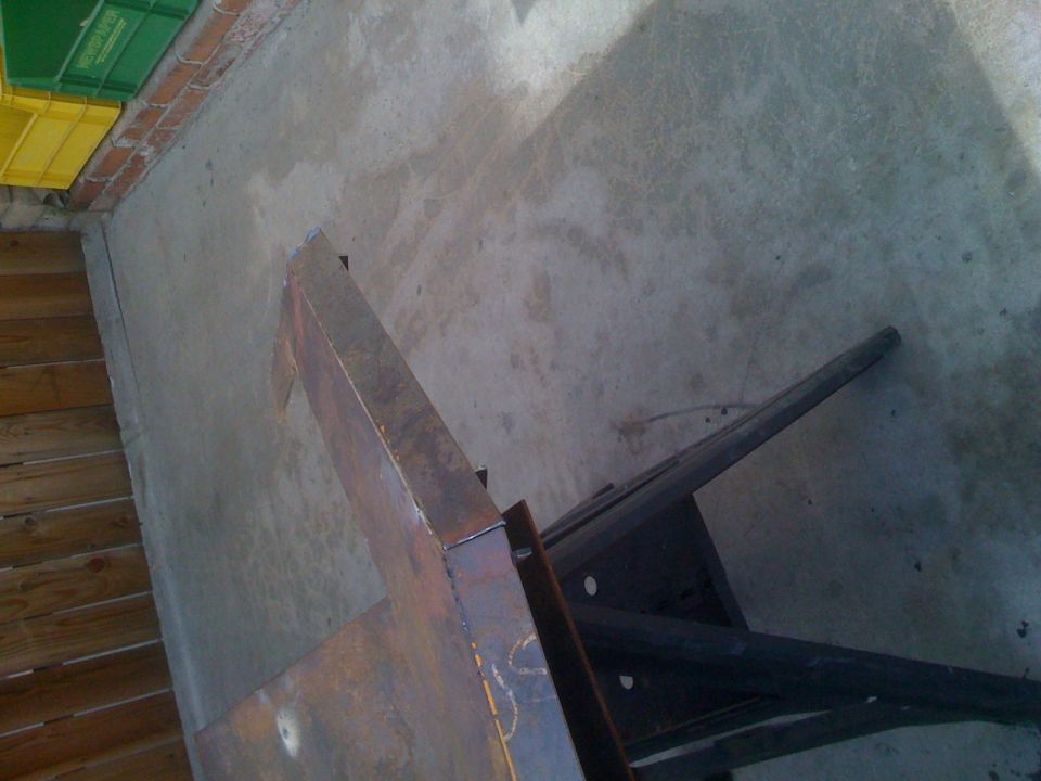 Rusted metal part on concrete floor