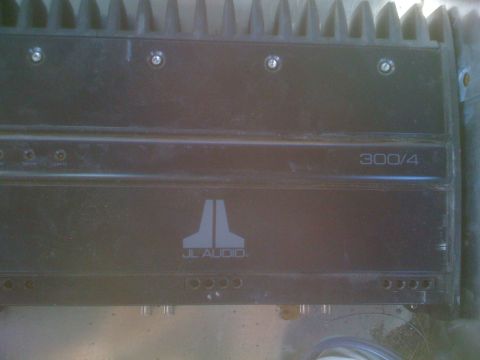 1992 Ford Bronco - JL Audio 300/4 amplifier shown close up, with heatsink fins visible.