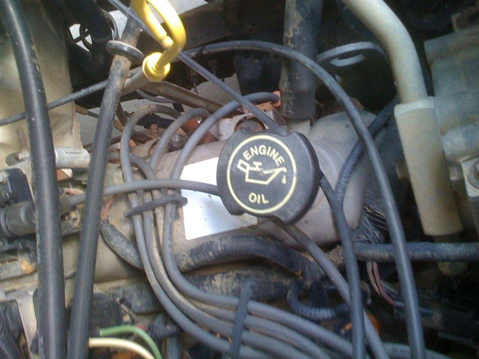 Engine bay with oil cap and wiring