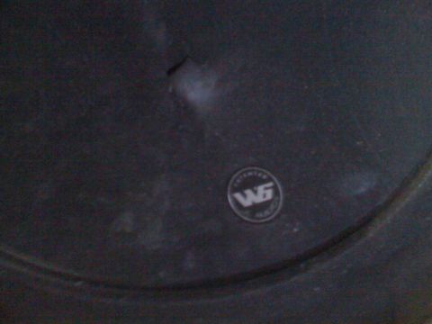 1992 Ford Bronco - A close-up view of a vehicle's wheel a WG emblem.