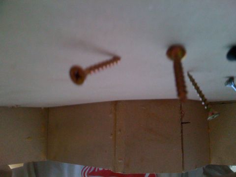 1992 Ford Bronco - Several screws are visible in the ceiling, with some casting distinct shadows.