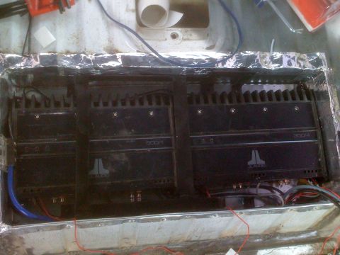1992 Ford Bronco - Three JL Audio amplifiers are visible, installed within the interior of a vehicle, suggesting a custom audio setup.