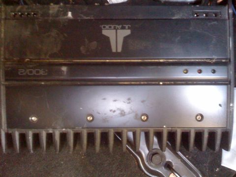 1992 Ford Bronco - A black JL Audio amplifier is shown, with visible text and indicator lights.